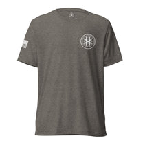Grey shirt, front view showing JSOC chest insignia.