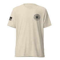 Oatmeal shirt, front view showing JSOC chest insignia.